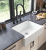 White ceramic kitchen sink in front of farmhouse/apron