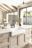 White ceramic kitchen sink in front of farmhouse/apron